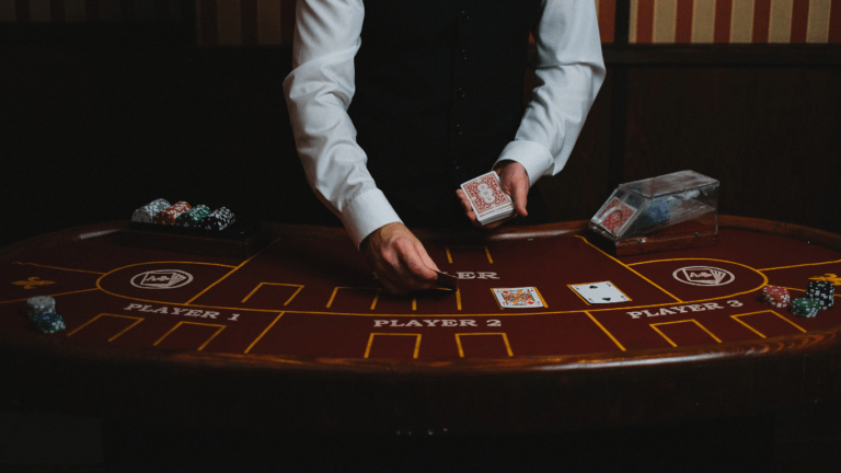 dealer placing cards in table