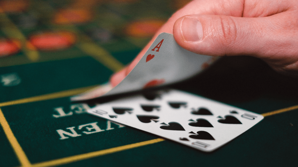 a man with cards playing poker