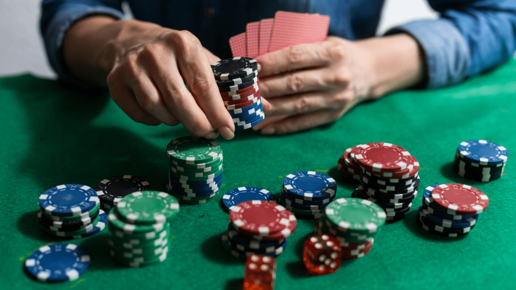 a man with cards and chips