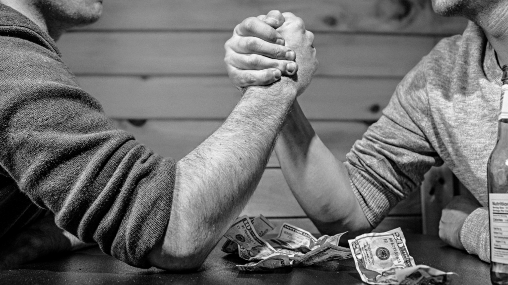 men playing arm wrestling